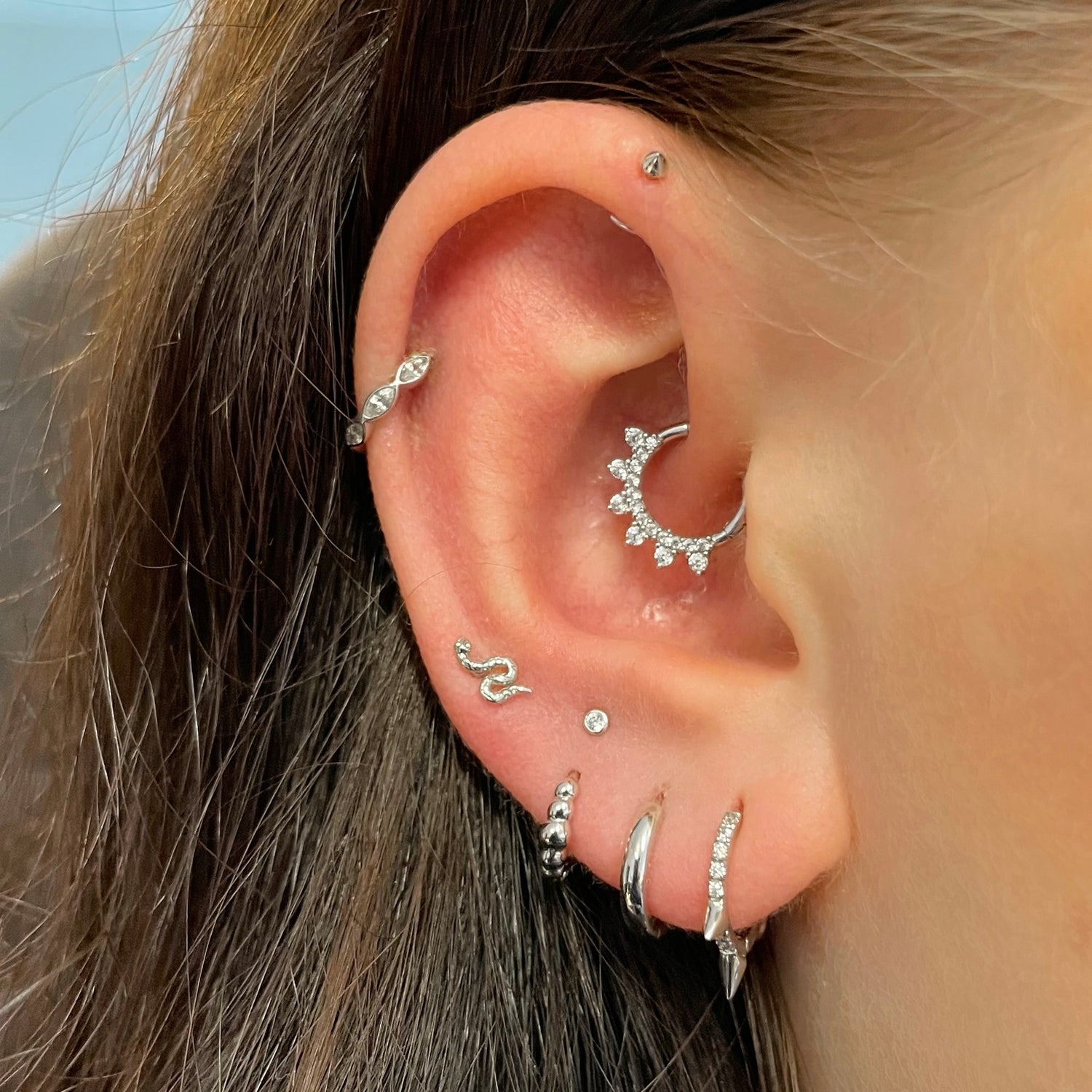 Beautiful jewelry for helix and tragus piercings with a beautiful star